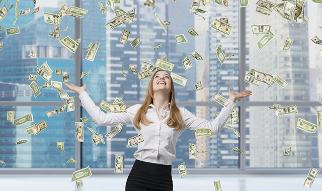 Beautiful blonde business woman is happy about falling dollar notes in the office. Singapore city background.